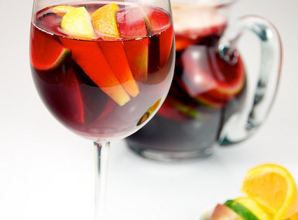 Red Wine Sangria with lemon, lime, apple, and orange served in a glass.